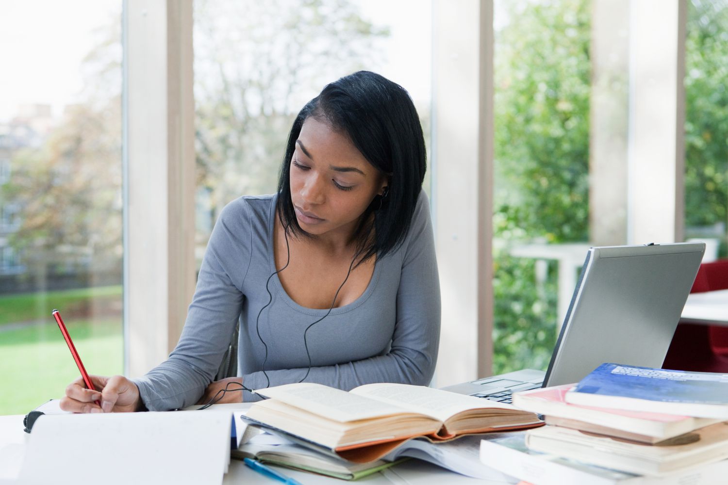 Academic notes and writing materials arranged for an essay project